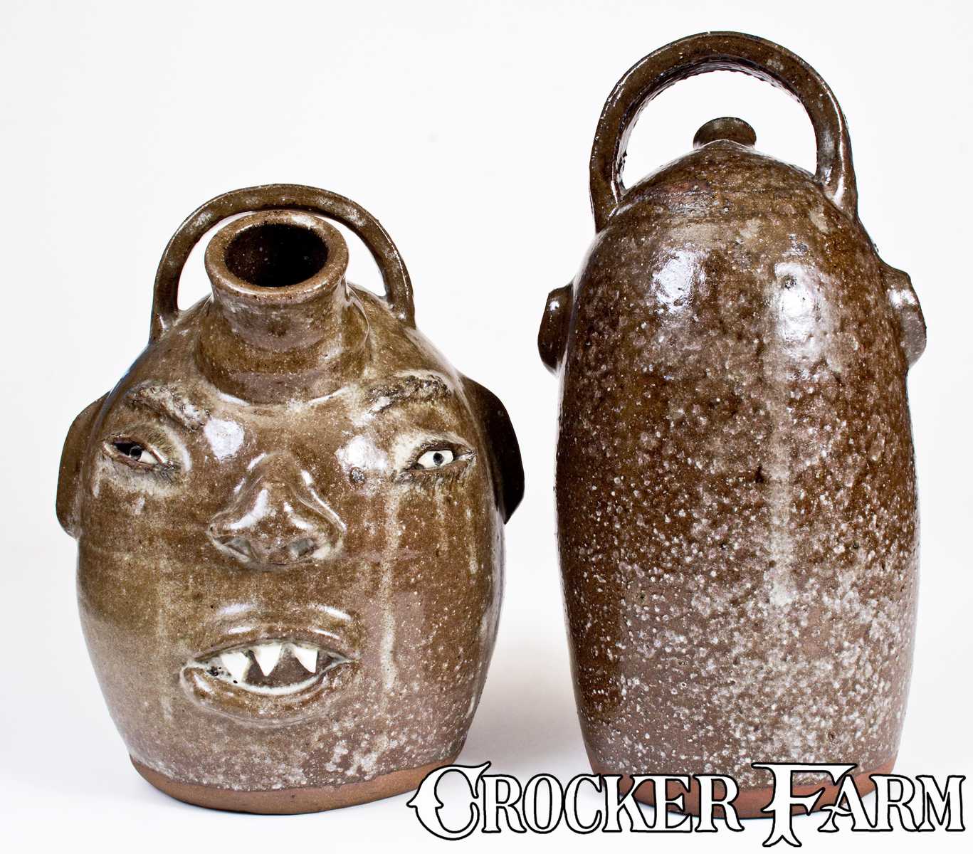 Two Alkaline-Glazed Face Harvest Jugs, Signed 