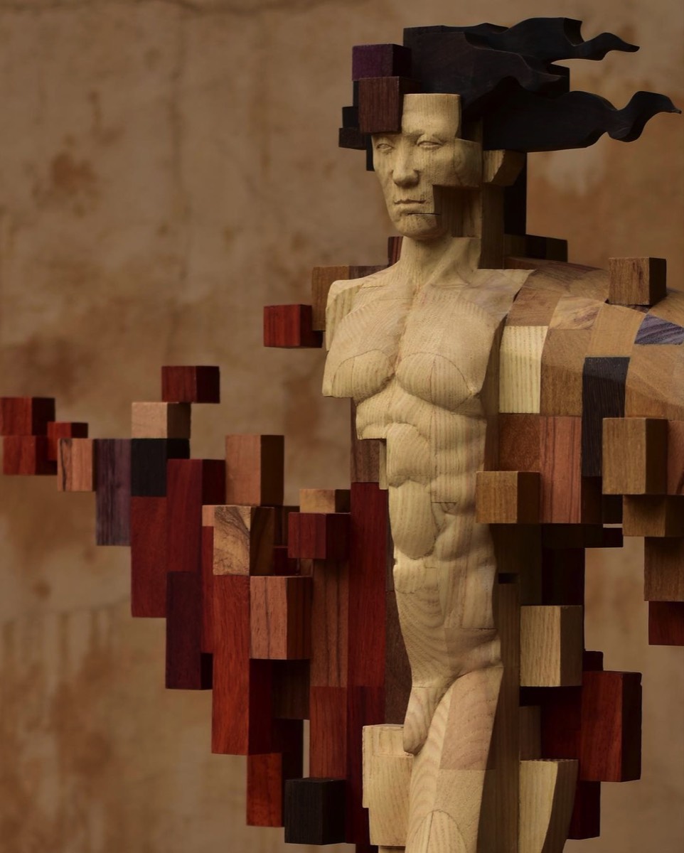 Sculptures from wood that appear to be puzzles of pixels by Hsu