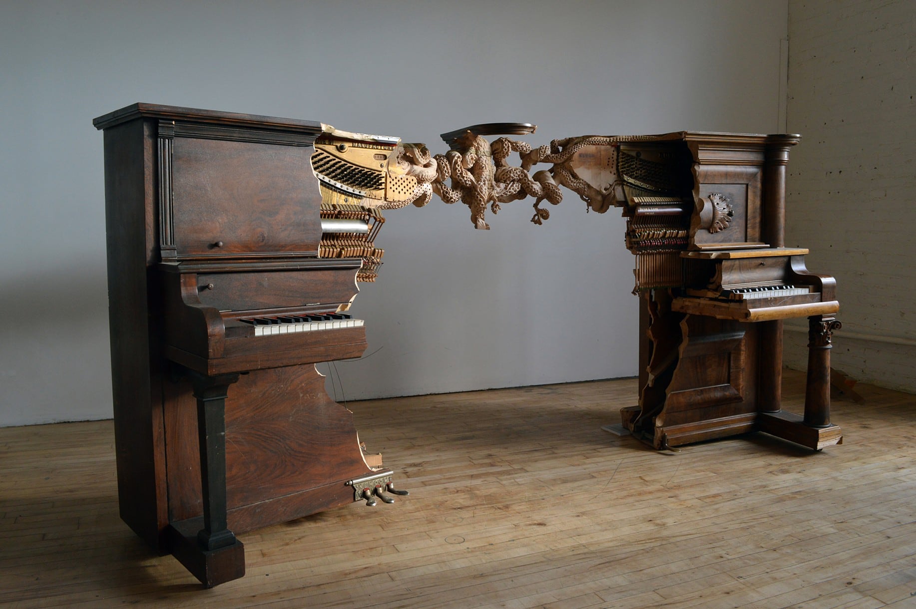 A Knotted Octopus Carved Directly into Two Pianos Entwines Maskull