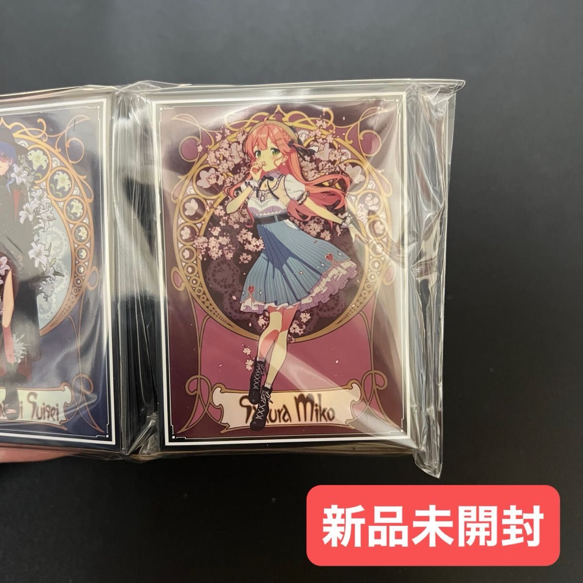 新品未開封】 ミュシャ風 ホロライブ さくらみこ スリーブ 混沌の女