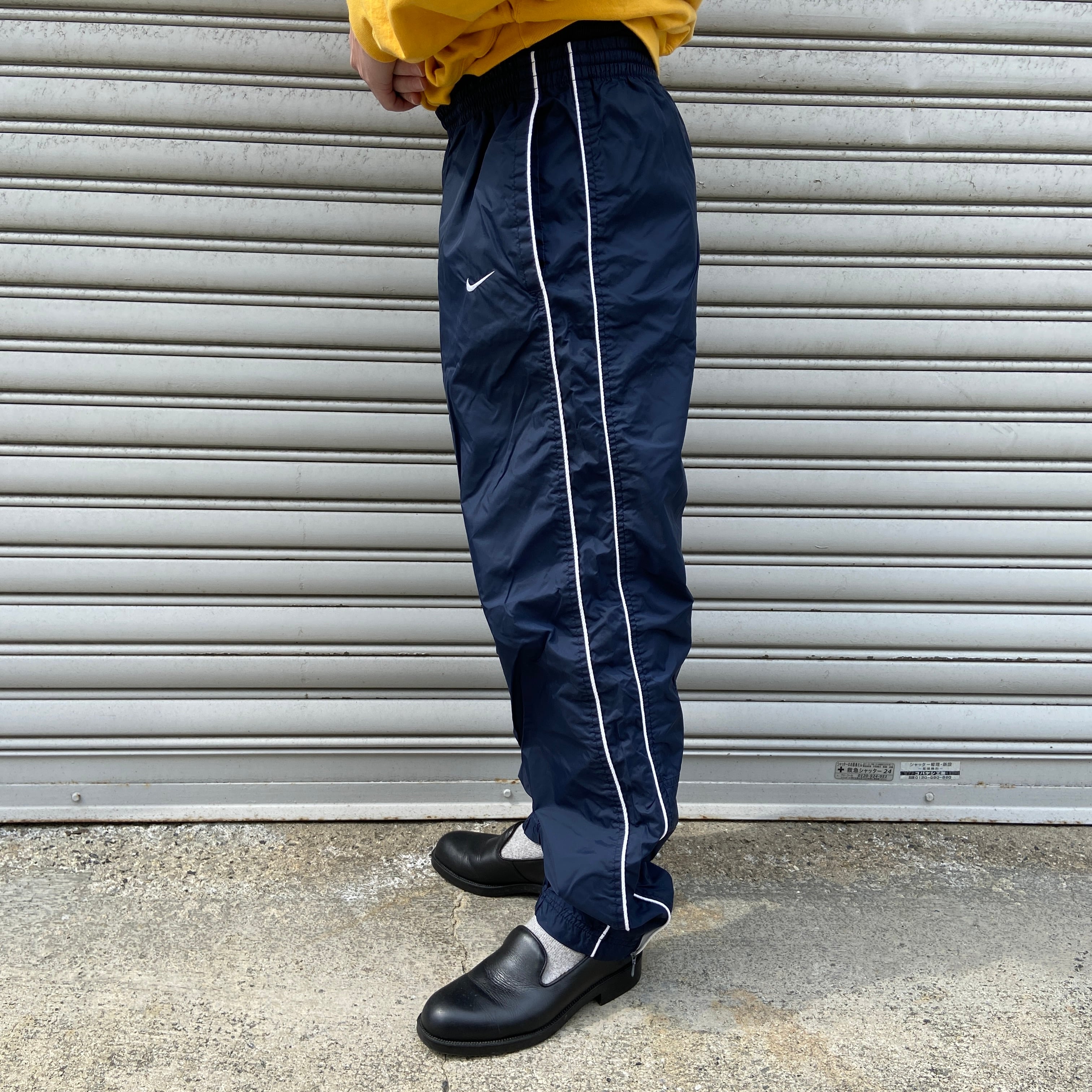 90s NIKE ナイロントラックパンツ L 白タグ 銀タグ ネイビー | 古着屋 Uan