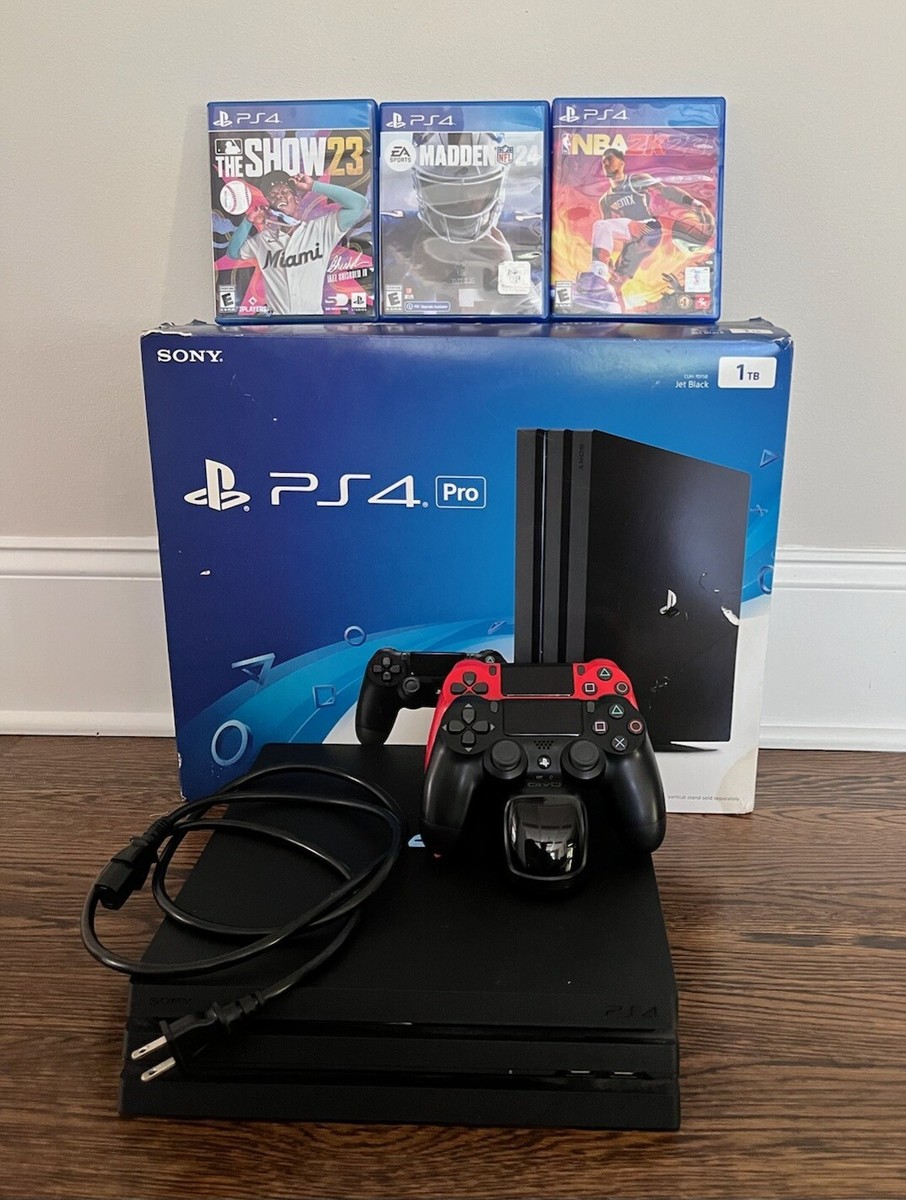 Sony PlayStation 4 Pro 1TB Console - Two Controllers - Games