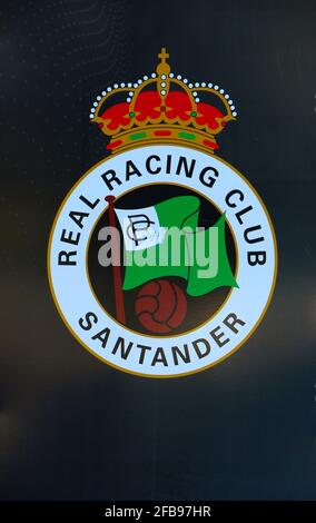 Large printed team badge on the wall next to an entrance for Real